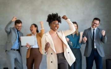 Success group of multiethnic entrepreneurs and business people achieving goals in modern corporate office